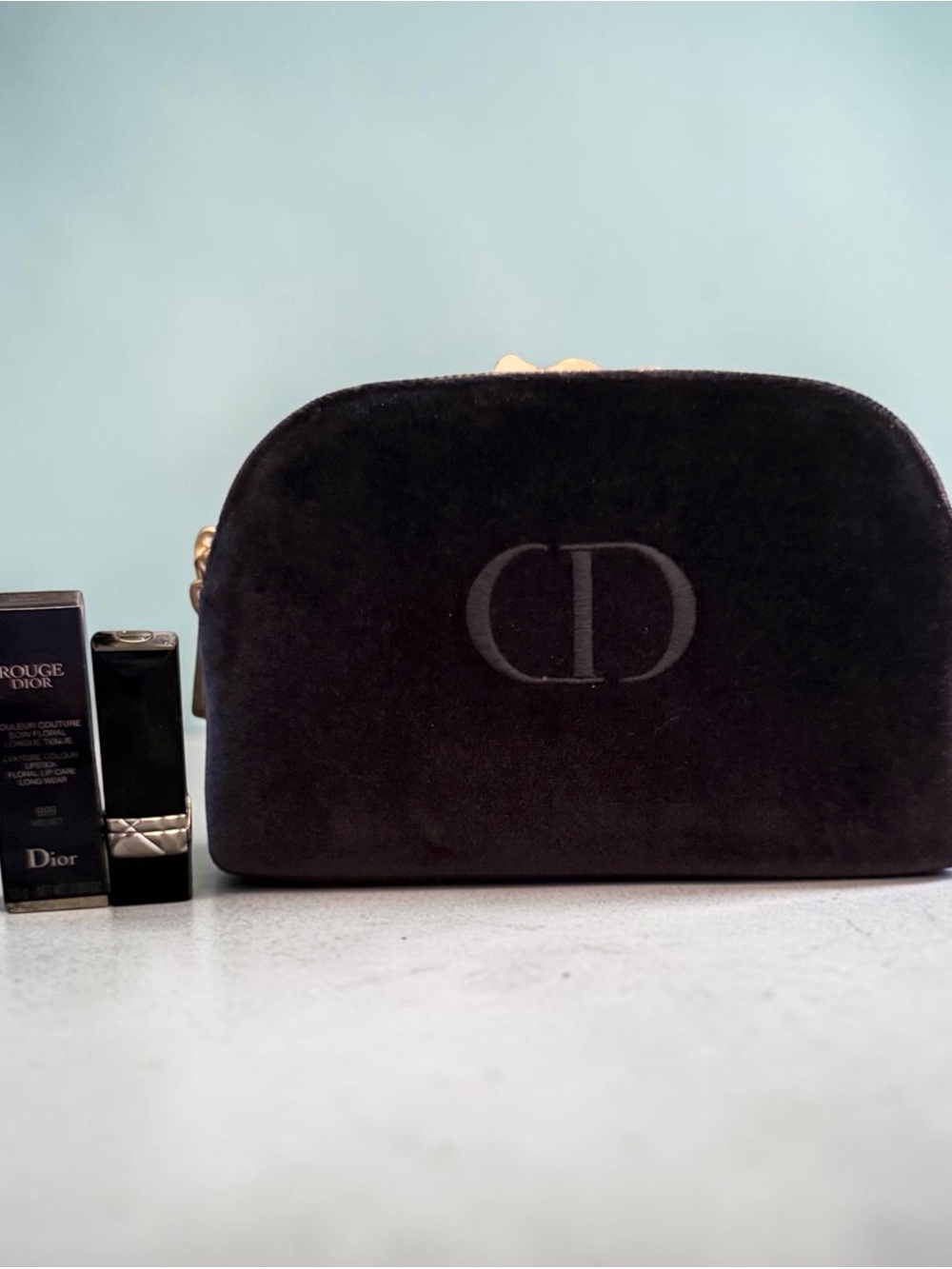 Dior Blue Velvet Cosmetic Pouch with CD Logo and Mini Rouge Dior lipstick.